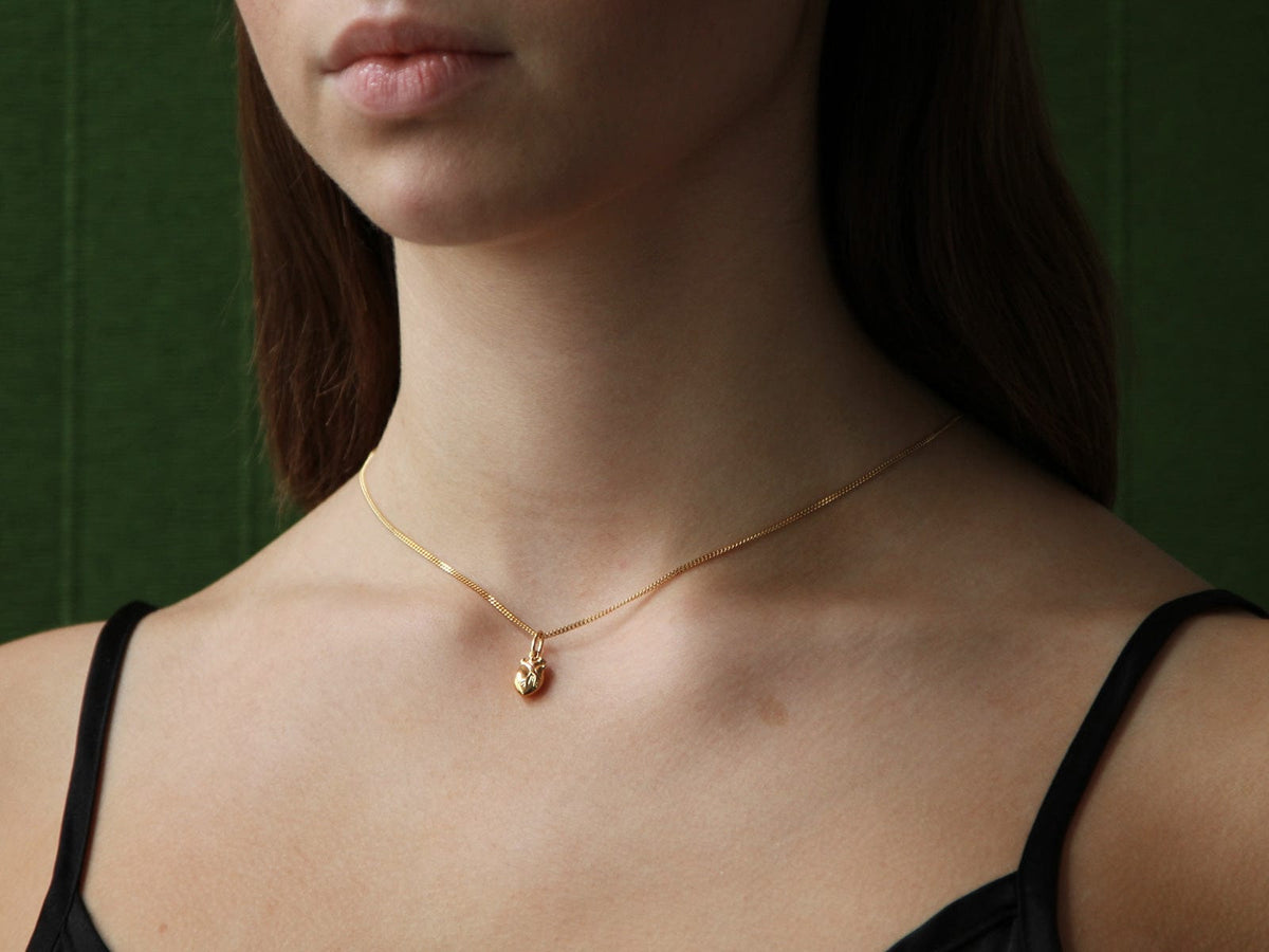 Human heart on sale necklace gold